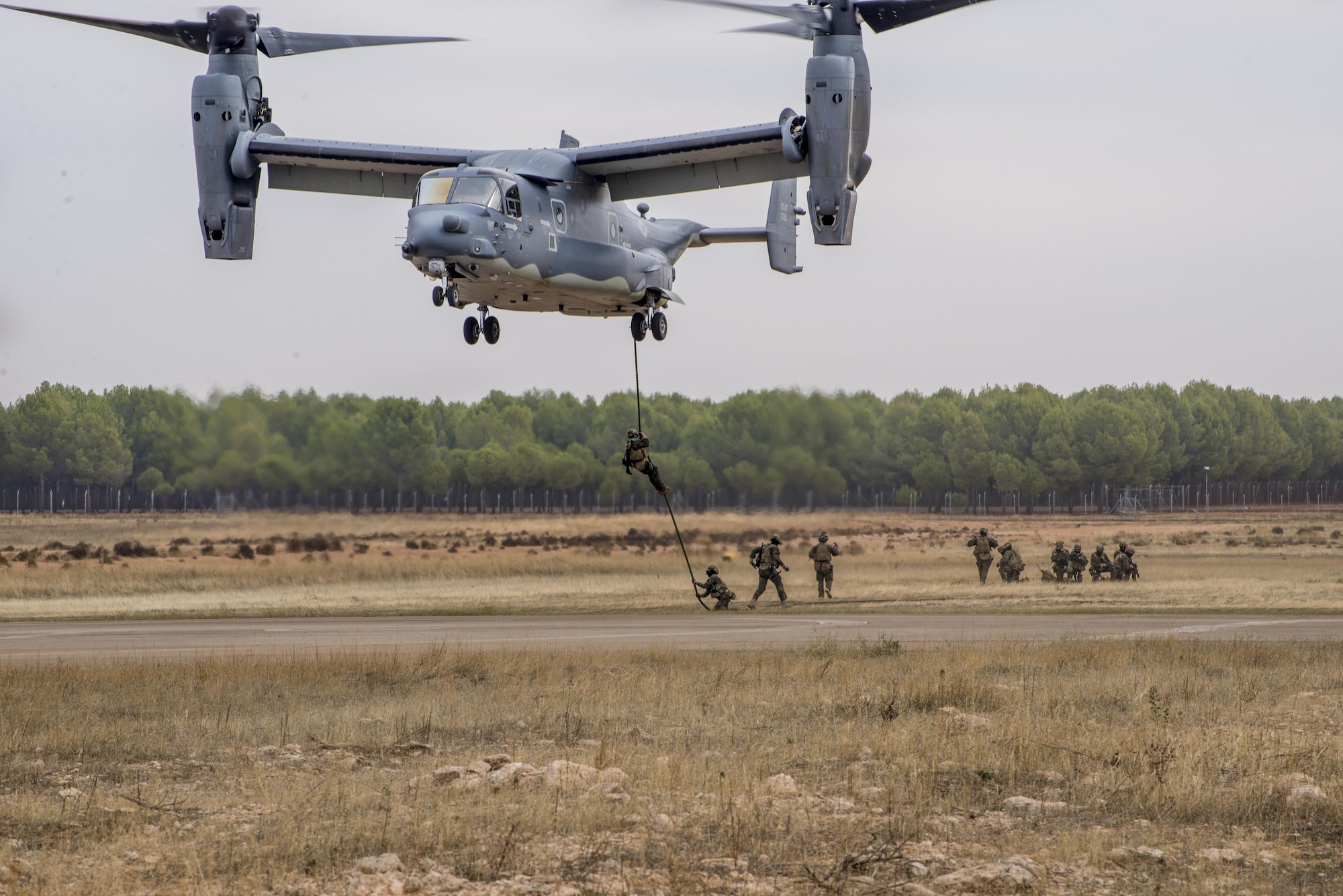 International partner commandos practice fast-roping procedures out the back of a U.S. CV-22 Osprey from the 352d Special Operations Wing in Almagro, Spain, Oct 24, 2015. The event was held as a part of TRIDENT JUNCTURE where partner nations trained air and ground forces on personnel rapid on and off-loading techniques. U.S. Air Force photo by 1st Lt. Chris Sullivan/Released)