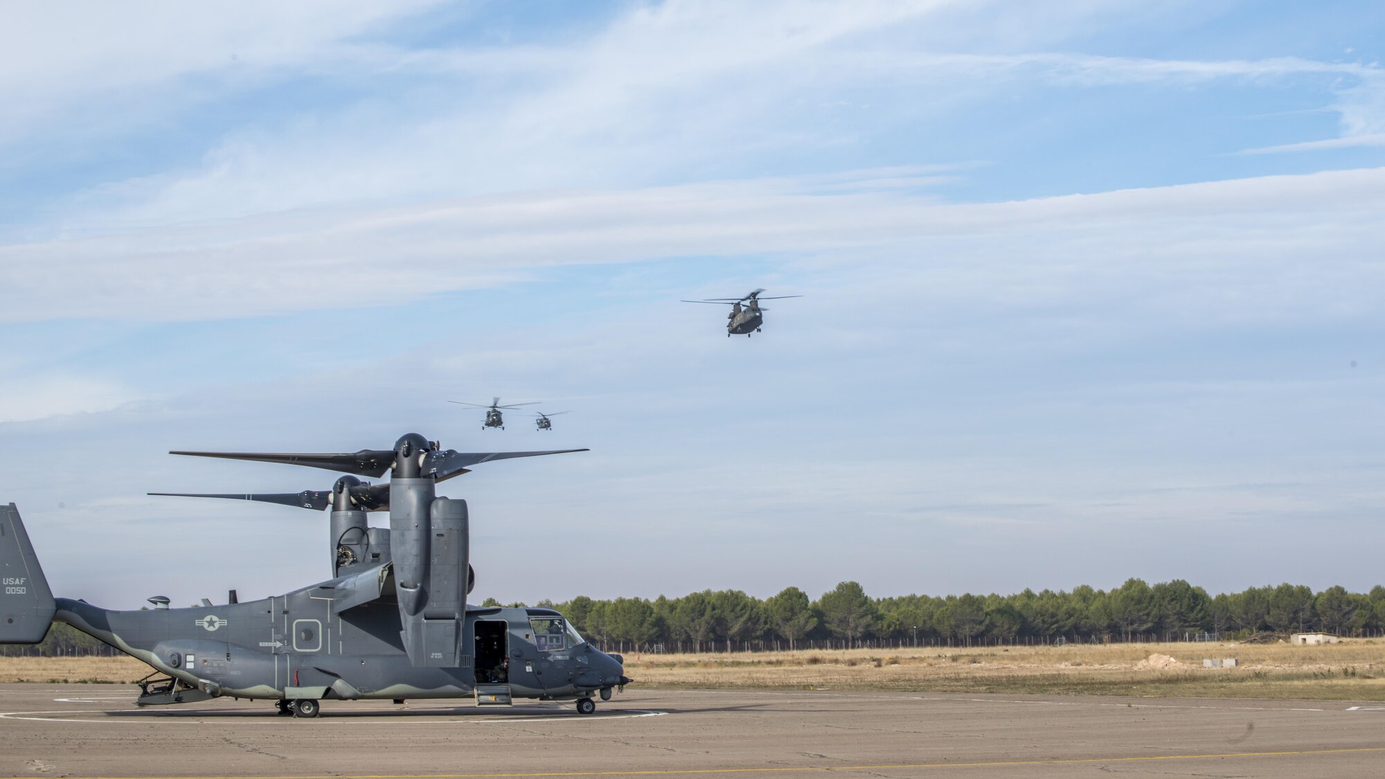 CV-22 Ospreys from the 352d Special Operations Wing traveled to Almagro, Spain to train in personnel off and on-loading procedures during TRIDENT JUNCTURE, Oct 24, 2015. The aircraft and crews joined several other rotary wing aircraft to train with ground forces on fast-rope, exfiltration and infiltration procedures. (U.S. Air Force photo by 1st Lt. Chris Sullivan/Released)