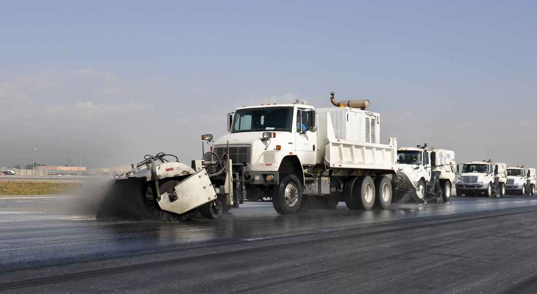 U.S. airmen remove rubber from the runway on Bagram Airfield, Afghanistan, Oct. 22, 2015. The airmen are assigned to the 577th Expeditionary Prime Base Engineer Emergency Force Squadron, deployed from Al Udeid Air Base, Qatar. U.S. Air Force photo by Tech. Sgt. Nicholas Rau