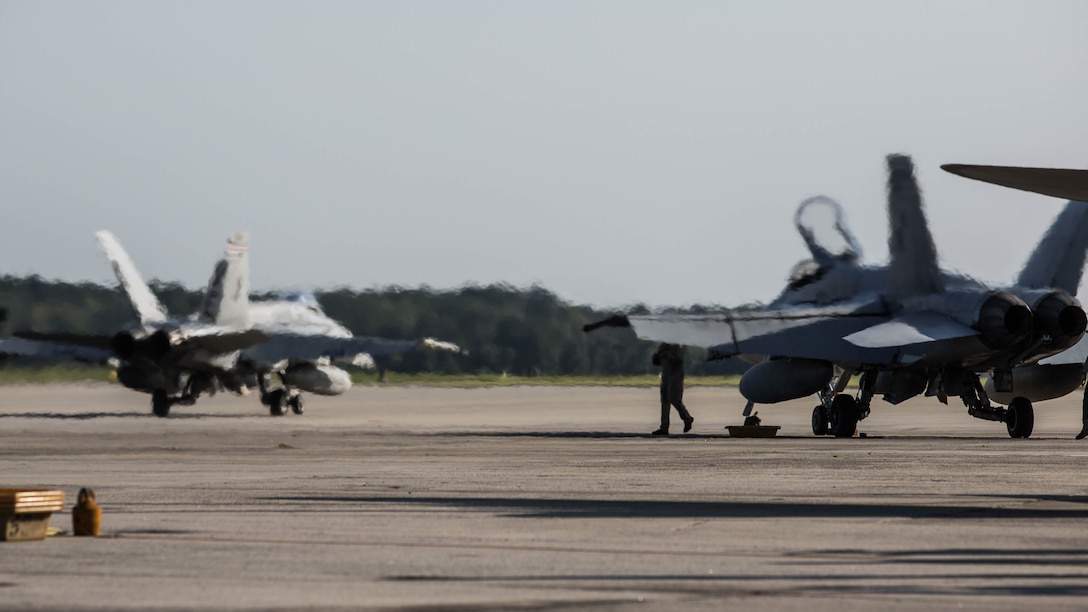 F/A-18C Hornets return to Marine Corps Air Station Beaufort , South Carolina, Oct. 26, 2015.  Marine Fighter Attack Squadron 115 and Marine All-Weather Fighter Attack Squadron 533 returned from Weapons and Tactics Instructor course aboard Marine Corps Air Station Yuma, Arizona. The Hornets are with Marine Fighter Attack Squadron 115, Marine Aircraft Group 31.
