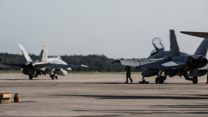 F/A-18C Hornets return to Marine Corps Air Station Beaufort , South Carolina, Oct. 26, 2015.  Marine Fighter Attack Squadron 115 and Marine All-Weather Fighter Attack Squadron 533 returned from Weapons and Tactics Instructor course aboard Marine Corps Air Station Yuma, Arizona. The Hornets are with Marine Fighter Attack Squadron 115, Marine Aircraft Group 31.