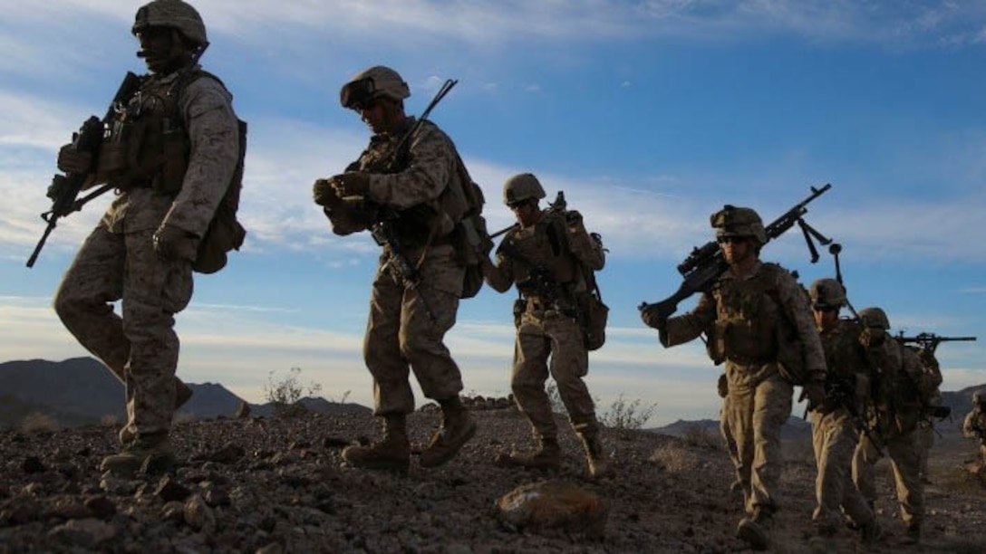 Marines with Alpha Company, 1st Battalion, 8th Marine Regiment hike to the starting point of their live-fire range during Integrated Training Exercise 1-16 aboard Marine Air Ground Combat Center, Twentynine Palms, Calif., Oct. 26, 2015. During ITX, Marines demonstrate core infantry mission essential tasks while conducting offensive and defensive stability operations.