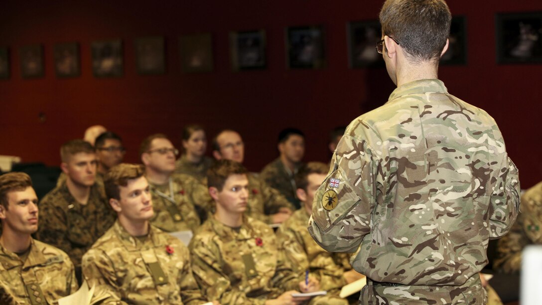 A British soldier addresses U.S. Marines and British soldiers before commencing Exercise Phoenix Odyssey II in Edinburgh, U.K., Oct. 25, 2015. The exercise is designed to bring both forces together to develop more effective ways to conduct joint intelligence operations and execute military skills.