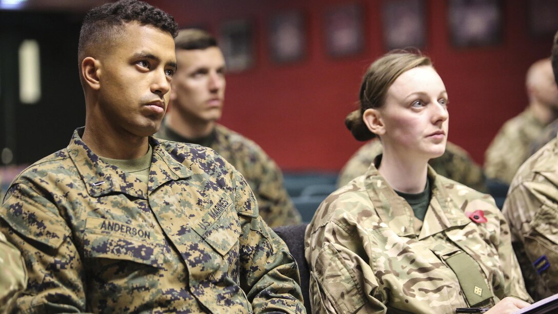 U.S. Marine 1st Lt. Steve E. Anderson, a watch chief with 2nd Intelligence Battalion and British soldiers attend a class before beginning Exercise Phoenix Odyssey II in Edinburgh, U.K., Oct. 25, 2015. For the second consecutive year, both forces will conduct intelligence training and practice military skills in order to increase proficiency and build long lasting partnerships.