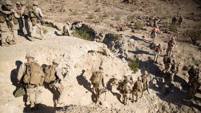 Marines with Company C, 1st Battalion, 8th Marine Regiment hike out to a live fire and maneuver exercise course during the Integrated Training Exercise 1-16 aboard Marine Corps Air Ground Combat Center Twentynine Palms, Calif. Oct. 23-24. During ITX, Marines demonstrate core infantry mission essential tasks while conducting offensive and defensive stability operations. 
