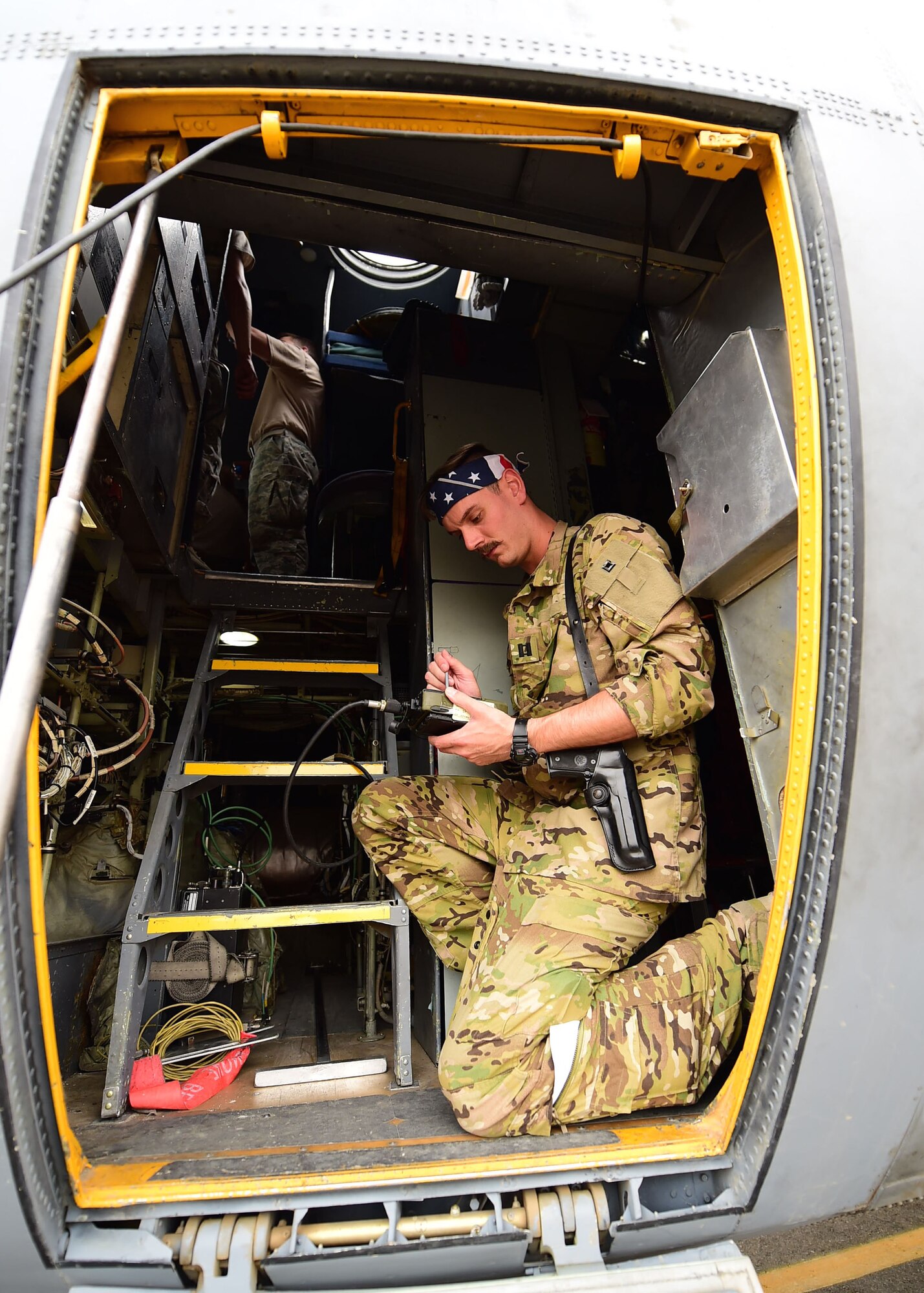 Capt. Drew Grotbo, 737th Expeditionary Airlift Squadron C-130H Hercules co-pilot, conducts pre-flight checks at an undisclosed location in Southwest Asia, Oct. 27, 2015. The mission of the 737th EAS is to provide airlift, airdrop and reconnaissance support for Operation INHERENT RESOLVE. (U.S. Air Force photo by Staff Sgt. Jerilyn Quintanilla)