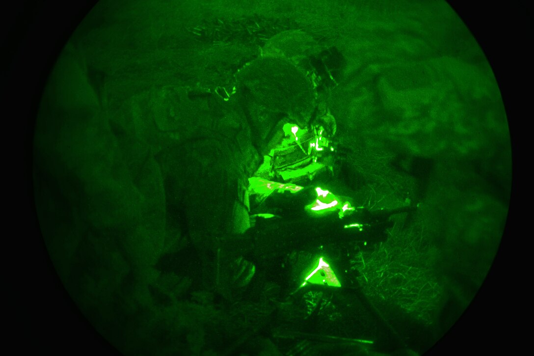 As seen through a night-vision device, U.S. paratroopers prepare a night live-fire exercise as part of Exercise Rock Proof  V at Pocek Range in Postojna, Slovenia, Oct. 20, 2015. U.S. Army photo by Davide Dalla Massara