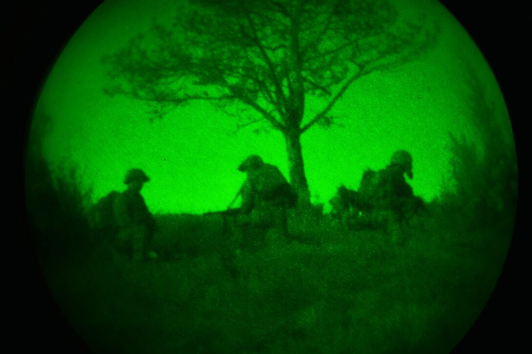 As seen through a night-vision device, U.S. paratroopers prepare a night live-fire exercise as part of Exercise Rock Proof  V at Pocek Range in Postojna, Slovenia, Oct. 20, 2015. U.S. Army photo by Davide Dalla Massara