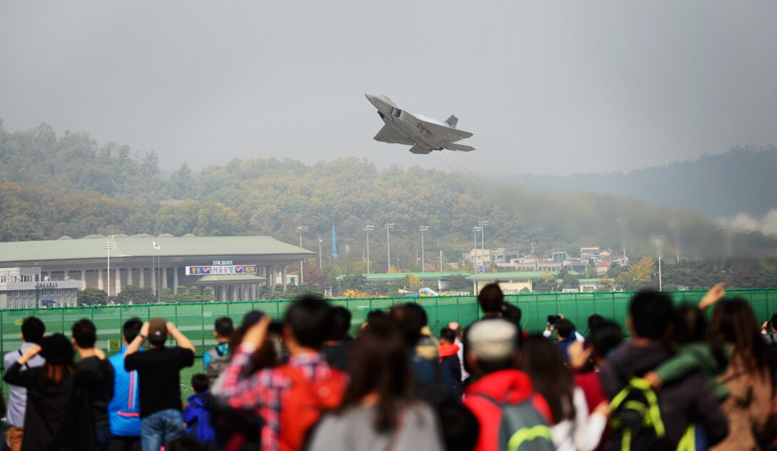 The F-22 Raptor demonstrates its unique flight capabilities for thousands of Korean civilians at the 2015 Seoul International Aerospace and Defense Exhibition held at Seoul Airport, South Korea, Oct. 24, 2015. The Seoul ADEX gives American service members a chance to showcase their outstanding aircraft and equipment to the Korean public. (U.S. Air Force photo/Staff Sgt. Amber Grimm)