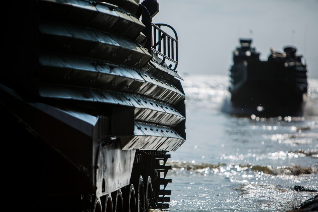 Two U.S. Marine Amphibious Assault Vehicles push towards a beachhead during the second amphibious assault of Blue Chromite 2016, at Kushii Crossing, Okinawa, Japan, Oct. 29, 2015. The Marines onboard pushed through and assaulted into combat town. Blue Chromite is a large-scale amphibious exercise that draws primarily from III Marine Expeditionary Force’s training resources on Okinawa. The location of the training allows participating units to maintain a forward-deployed posture and eliminates the cost of traveling to train. The AAVs are with 2nd Assault Amphibian Battalion, currently assigned to Combat Assault Battalion, 3rd Marine Division, III MEF, under the unit deployment program.