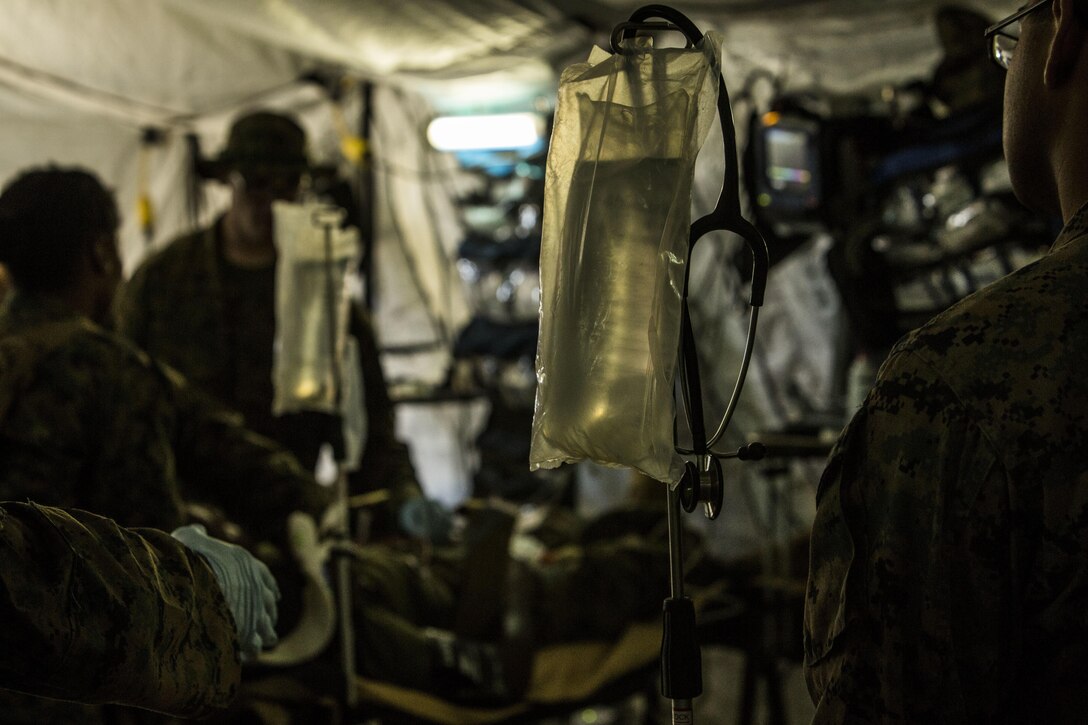 Marines and Sailors with the Shock Trauma Platoon, 3rd Medical Battalion, 3rd Marine Logistics Group, III Marine Expeditionary Force, set up a field hospital during a mass casualty drill for Blue Chromite 2016, at Central Training Area, Okinawa, Japan, Oct. 29, 2015. Blue Chromite is a large-scale amphibious exercise that draws primarily from III Marine Expeditionary Force’s training resources on Okinawa. The location of the training allows participating units to maintain a forward-deployed posture and eliminates the cost of traveling to train.