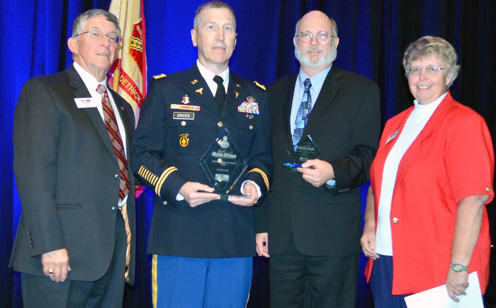 (From left) Craig Lebo, National Museum of Civil War Medicine board member; Col. (Dr.) Kirby Gross, U.S. Army Institute of Surgical Research Joint Trauma System director; Dr. Kenneth Bertram, U.S. Army Medical Research and Materiel Command principal assistant for acquisition; and Betsy Estilow, National Museum of Civil War Medicine board president during the eighth annual Maj. Jonathan Letterman Award for Medical Excellence by the National Museum of Civil War Medicine Oct. 8 in Bethesda, Md. Gross accepted the award for the USAISR JTS.