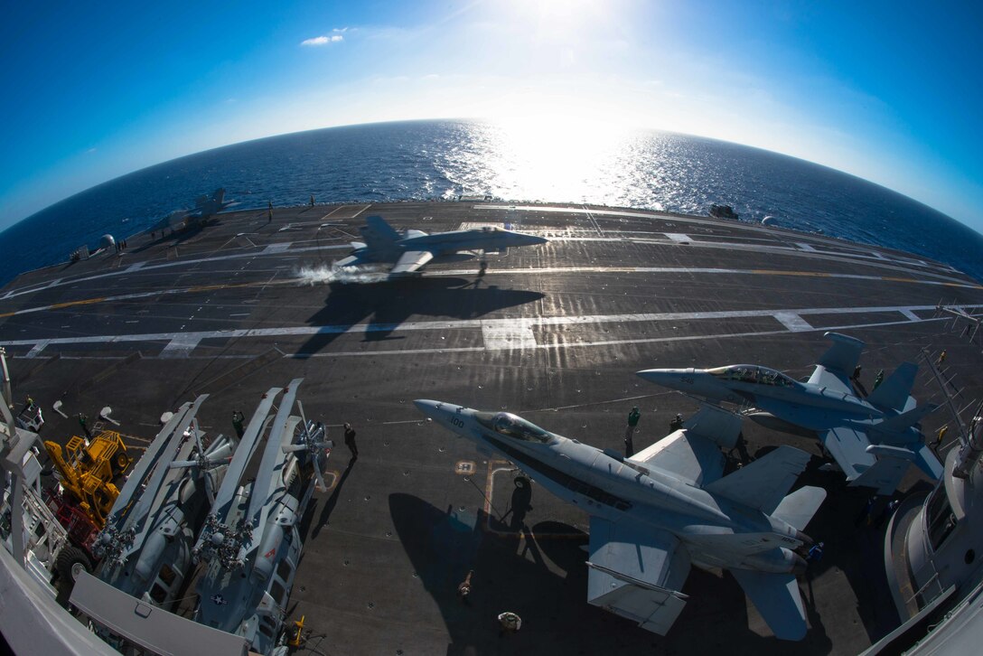 An F/A-18C Hornet catches an arresting gear cable as it lands on the flight deck of the USS John C. Stennis in the Pacific Ocean, Oct. 23, 2015. The Hornet is assigned to Marine Fighter Attack Training Squadron 101. U.S. Navy photo by Petty Officer 3rd Class Andre T. Richard