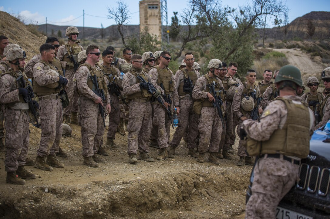 Marines with 4th Light Armored Reconnaissance Battalion, 4th Marine Division stand by during a safety brief before they conduct live fire drills during exercise Trident Juncture 2015 in Almeria, Spain, Oct. 27, 2015. Live fire drills allow Reserve Marines to train in realistic environments and maintain a high state of readiness. More than 36,000 troops from more than 30 nations are participating in the exercise which is the largest NATO has conducted in the past 10 years.