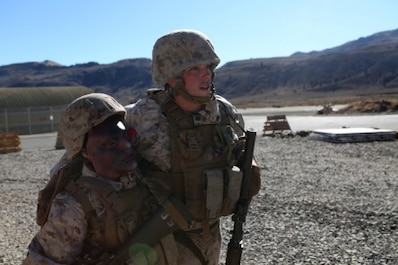 Cpl. James Negri, combat engineer, Combat Logistics Battalion 11, 1st Marine Logistics Group, helps a casualty get to safety after a simulated suicide bomber attack during Mountain Exercise 6-15 at Marine Corps Mountain Warfare Training Center, Bridgeport, Calif., Oct. 25, 2015. Engineer Platoon conducted two consecutive days of security patrols to ensure the safety of the base camp and was confronted with the challenge of a mass casualty event at the end of their patrol.