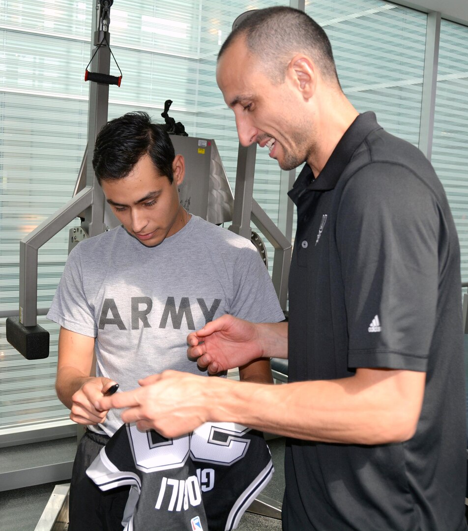 Manu Ginobili signed a Spurs jersey for George Guerra at the Center for the Intrepid Oct. 21.