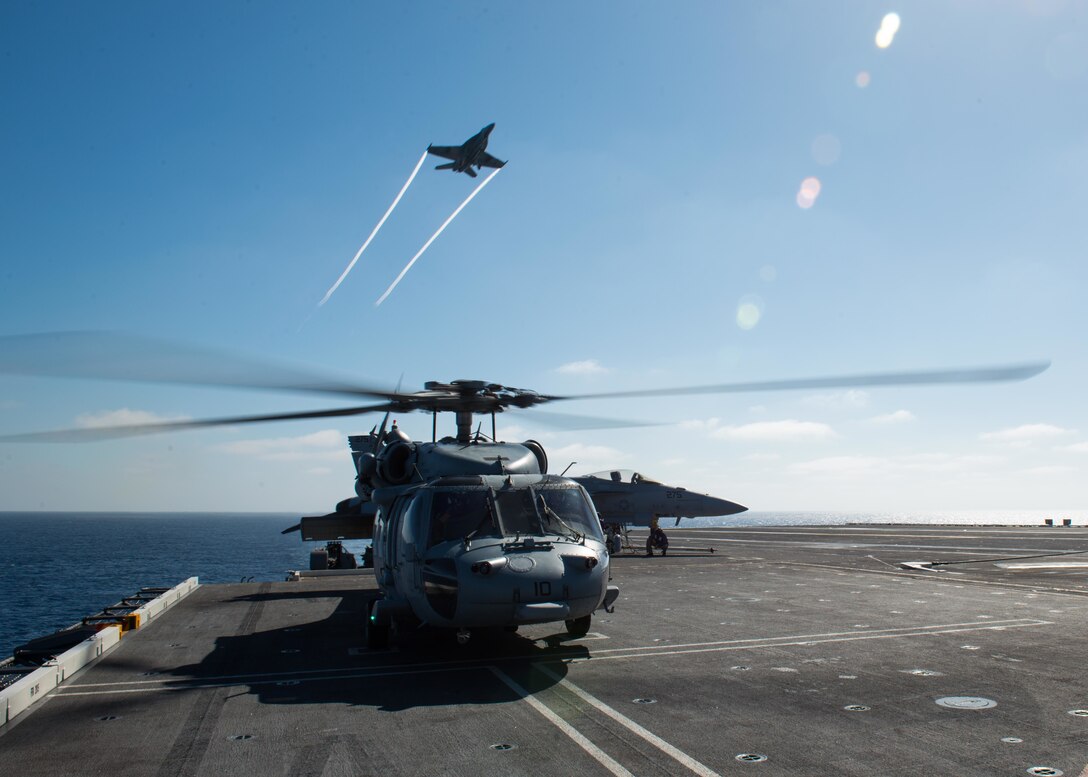 An MH-60S Sea Hawk helicopter assigned to the Chargers of Helicopter Sea Combat Squadron 14 prepares to take off from the flight deck aboard the USS John C. Stennis in the Pacific Ocean, Oct. 26, 2015. U.S. Navy photo by Seaman Apprentice Weston A. Mohr