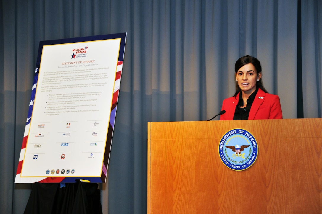 Kristine Kash, a military spouse and an employee of Military Spouse Employment Partnership partner Starbucks, shares her personal story and career path during a Military Spouse Employment Partnership induction ceremony at the Mark Center in Alexandria, Va., Oct. 28, 2015. Since its launch in 2011, Military Spouse Employment Partnership employers have posted more than 4 million jobs and hired more than 80,000 military spouses. DoD photo by Reza Hajiha