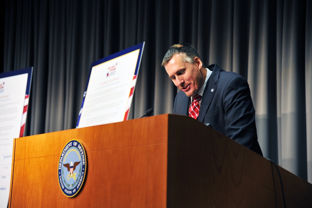 Eddy Mentzer, associate director of the family readiness policy for Department of Defense Military Community and Family Policy, speaks during a Military Spouse Employment Partnership induction ceremony at the Mark Center in Alexandria, Va., Oct. 28, 2015. Mentzer said the talent of military spouses can strengthen the economy, military families, the Defense Department and the nation. DoD photo by Reza Hajiha