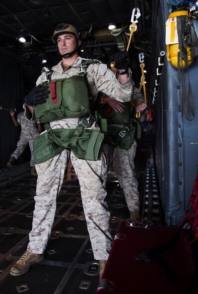 Marine Sgt. Jason Ingham, 4th Recon Battalion Bravo Company, prepares for his low-level tactical jump from a U.S. Air Force C-130 Hercules at Dobbins Air Reserve Base, Ga. Oct. 15, 2015. The 700th AS performed personnel drops working with 4th RBBC. This exercise marked the first time in four years that these units had worked together for parachutes jumps. (U.S. Air Force photo/ Staff Sgt. Daniel Phelps)