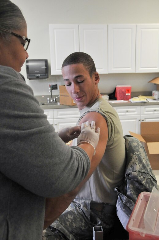 Spc. Aleksandr Piovesan of the Army Reserve’s 2nd Battalion, 228th Aviation Regiment receives a mandatory influenza vaccination during the mass medical-readiness event hosted Oct. 17-18 by the Army Reserve’s 99th Regional Support Command at Joint Base McGuire-Dix-Lakehurst, N.J., in an effort to increase Soldier readiness throughout the northeastern United States. More than 750 Army Reserve Soldiers from throughout the 99th RSC’s 13-state area of support received mandatory influenza vaccinations and other medical services.