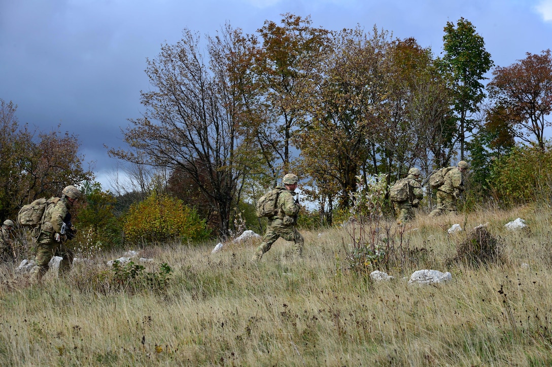 U.S. paratroopers advance up a hill toward their next objective during live-fire training as part of Rock Proof V at Pocek Range in Postojna, Slovenia, Oct. 19, 2015. U.S. Army photo by Paolo Bovo