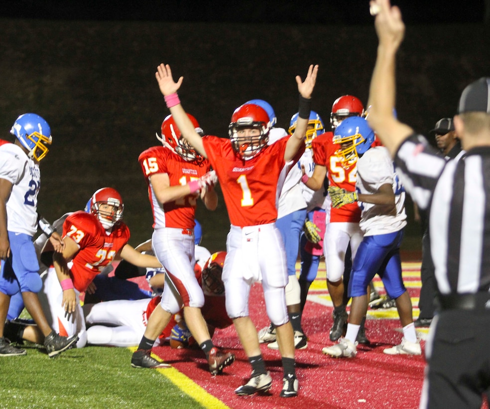 Jack Kelly, no. 1, makes touchdown during the fourth-quarter to get a lead for the Quantico High/Middle School over the Northhamton High School Oct. 23 at Butler Stadium aboard Marine Corps Base Quantico. This season the high school quarterback has completed 130-passing yards with one impressive 99-yard touchdown pass to teammate Caleb Hall.