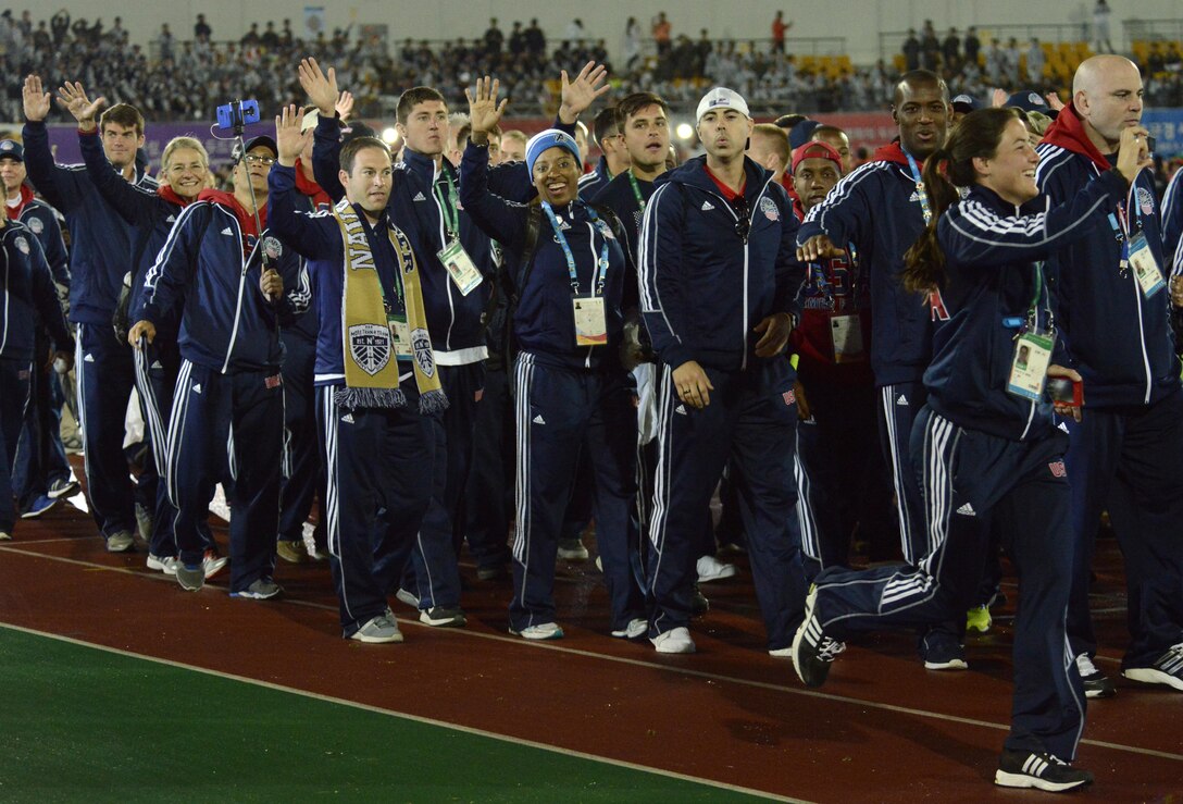 U.S. armed forces athletes wave to the crowd as they walk into the closing ceremony of the CISM World Games in the main stadium of the Korean Armed Forces Athletic Corps in MunGyeong, South Korea, Oct. 11, 2015.
