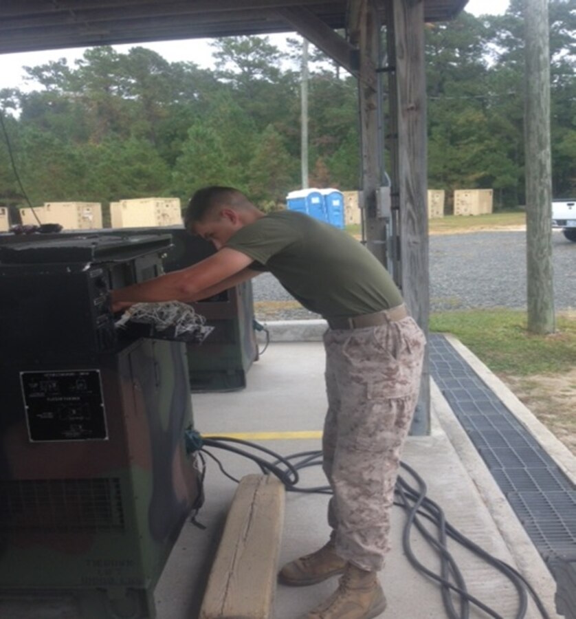 LCpl Jesse K. Johnston, a Marine attached to Basic Engineer Equipment Electrical Systems Technician course 9-15 (BEEEST 9-15) conducts a practical application on how to troubleshoot and repair the Bravo-series of generators at Marine Corps Engineer School, Camp Lejeune, N.C. 

 

