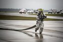A firefighter from the 23rd Civil Engineer Squadron runs toward a simulated aircraft crash scene during a major accident response exercise Oct. 27, 2015, at Moody Air Force Base, Ga. Once the firefighters were able to put out the fire and secure the scene, they were able to assist in removing patients from the area. (U.S. Air Force photo/Senior Airman Ryan Callaghan)