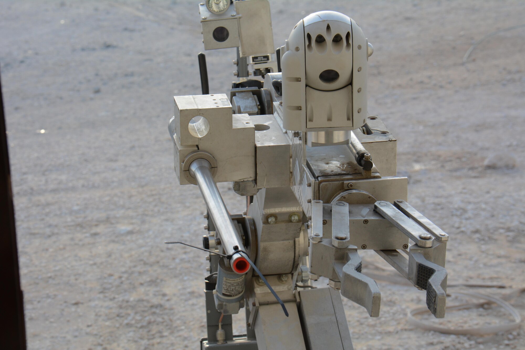 F-6, a robot designed to locate explosive devices, searches for explosives during an interagency training exercise at Al Udeid Air Base, Qatar Oct. 27. The robot belongs to the 379th Civil Engineer Squadron Explosive Ordnance Disposal section and is often used to detect explosives before EOD technicians attempt to diffuse or remove such devices. The exercise featured professionals from three 379th Air Expeditionary Wing units including firefighters and security forces patrolmen and provided first responders with an opportunity to work together and learn from one another. (U.S. Air Force photo by Tech. Sgt. James Hodgman)