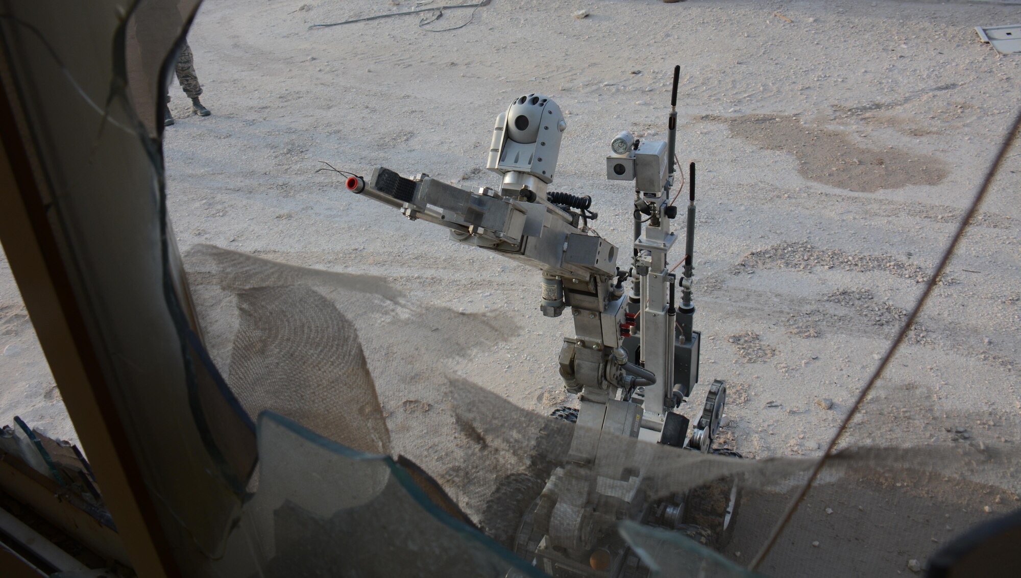 F-6, a robot designed to locate explosive devices, searches for mock explosives during an interagency training exercise at Al Udeid Air Base, Qatar Oct. 27. The robot belongs to the 379th Expeditionary Civil Engineer Squadron Explosive Ordnance Disposal section and is often used to detect explosives before EOD technicians attempt to diffuse or remove such devices. The exercise featured professionals from three 379th Air Expeditionary Wing units including firefighters and security forces patrolmen and provided first responders with an opportunity to work together and learn from one another. (U.S. Air Force photo by Tech. Sgt. James Hodgman)