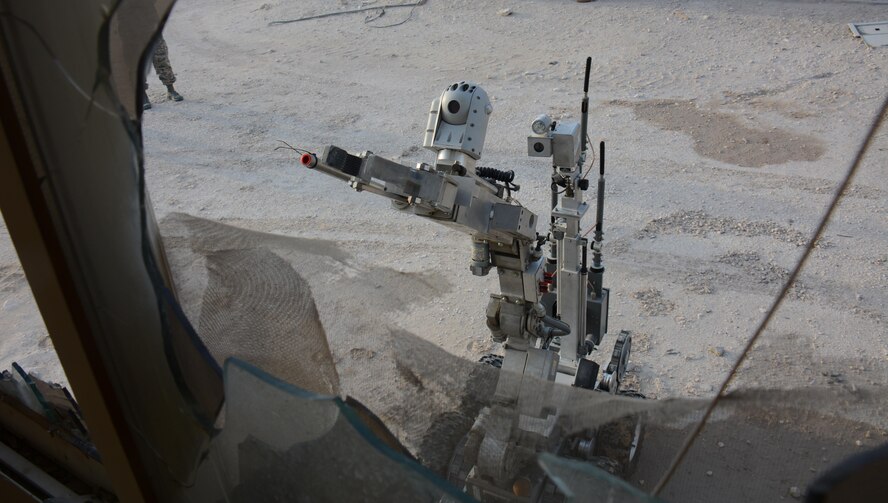 F-6, a robot designed to locate explosive devices, searches for mock explosives during an interagency training exercise at Al Udeid Air Base, Qatar Oct. 27. The robot belongs to the 379th Expeditionary Civil Engineer Squadron Explosive Ordnance Disposal section and is often used to detect explosives before EOD technicians attempt to diffuse or remove such devices. The exercise featured professionals from three 379th Air Expeditionary Wing units including firefighters and security forces patrolmen and provided first responders with an opportunity to work together and learn from one another. (U.S. Air Force photo by Tech. Sgt. James Hodgman)