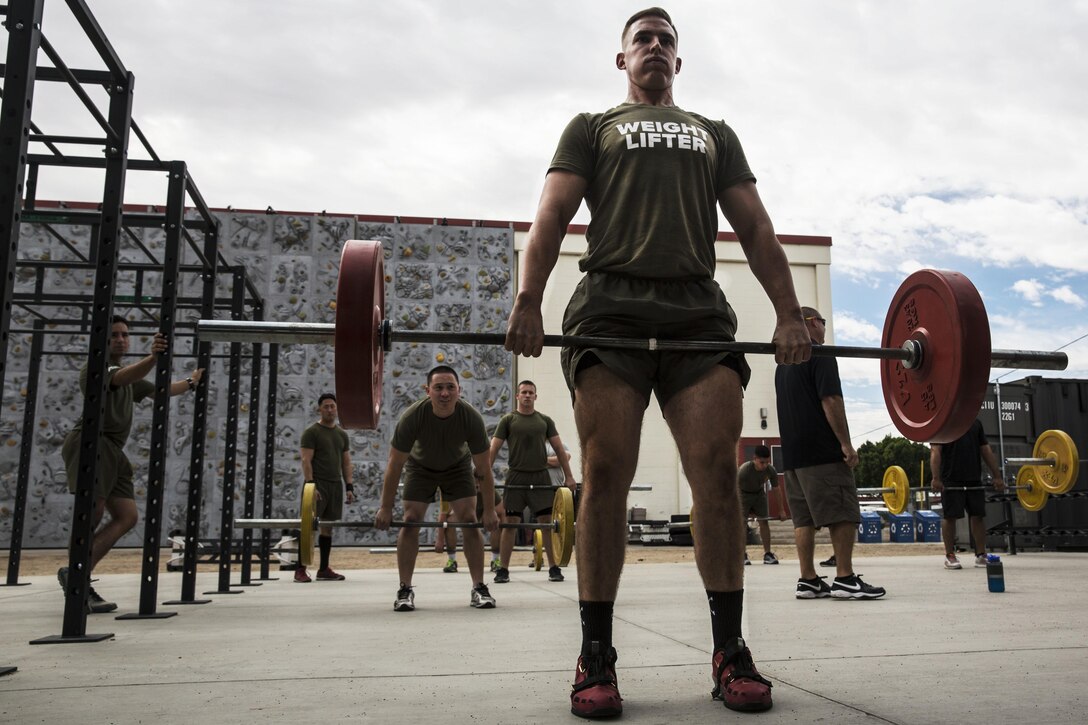 Marine Corps Sgt. Joshua Morris executes a Romanian deadlift during a High Intensity Tactical Training Level 1 instructor course at the gym on Marine Corps Air Station Yuma, Ariz., Oct. 28, 2015. Morris is an air traffic controller with Marine Air Control Squadron 1. U.S. Marine Corps photo by Pvt. George Melendez