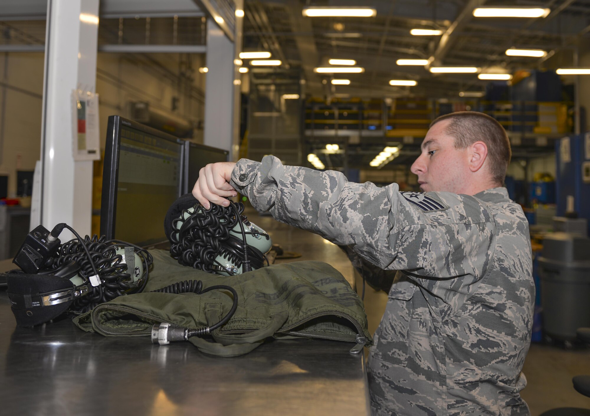 Staff Sgt. Travis Barry, 33rd Aircrafts Maintenance Squadron support technician, checks out equipment to crew chiefs at Eglin Air Force Base, Fla., Oct. 28, 2015.  Support Airmen at the 33rd Fighter Wing supply maintainers with equipment to service the F-35A Lightning II. (U.S. Air Force Photo/Senior Airman Andrea Posey)