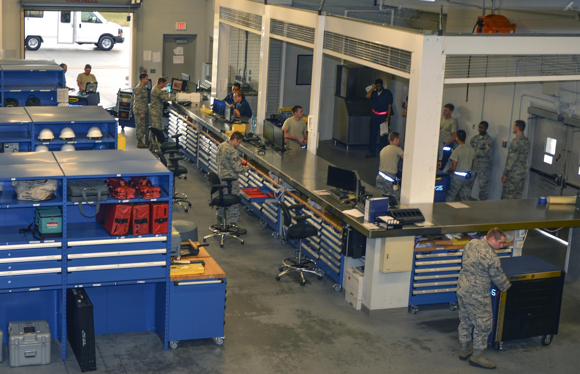 Support Airmen from the 33rd Aircrafts Maintenance Squadron supply crew chiefs with equipment at Eglin Air Force Base, Fla., Oct. 28, 2015.  There are approximately eight Airmen working at the supply desk at any time during morning, mid and night shifts. (U.S. Air Force Photo/Senior Airman Andrea Posey)