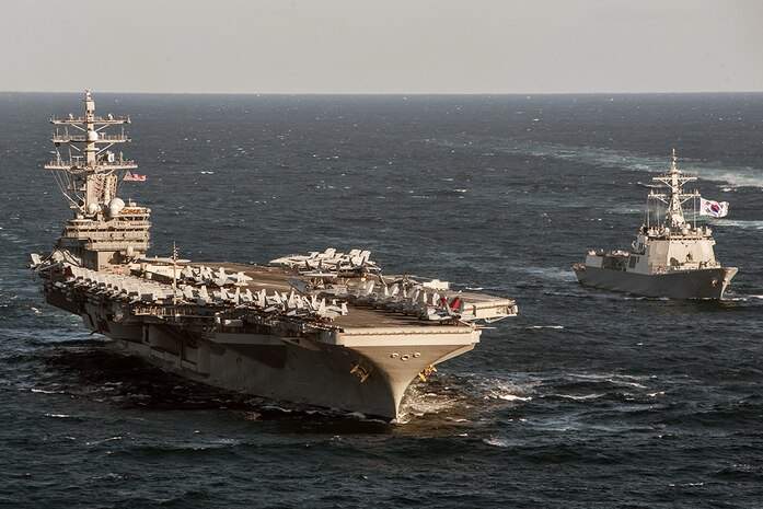 WATERS TO THE EAST OF THE KOREAN PENINSULA (Oct. 28, 2015) - The U.S. Navy's only forward-deployed aircraft carrier USS Ronald Reagan (CVN 76) steams alongside the Republic of Korea (ROK) Navy destroyer Sejong the Great (DDG 991) during a photo exercise. Ronald Reagan is participating in bilateral training with ROK Navy to strengthen the U.S.-ROK alliance and improve regional security. Ronald Reagan and its embarked air wing, Carrier Air Wing (CVW) 5, provide a combat-ready force that protects and defends the collective maritime interests of the U.S. and its allies and partners in the Indo-Asia-Pacific region.  