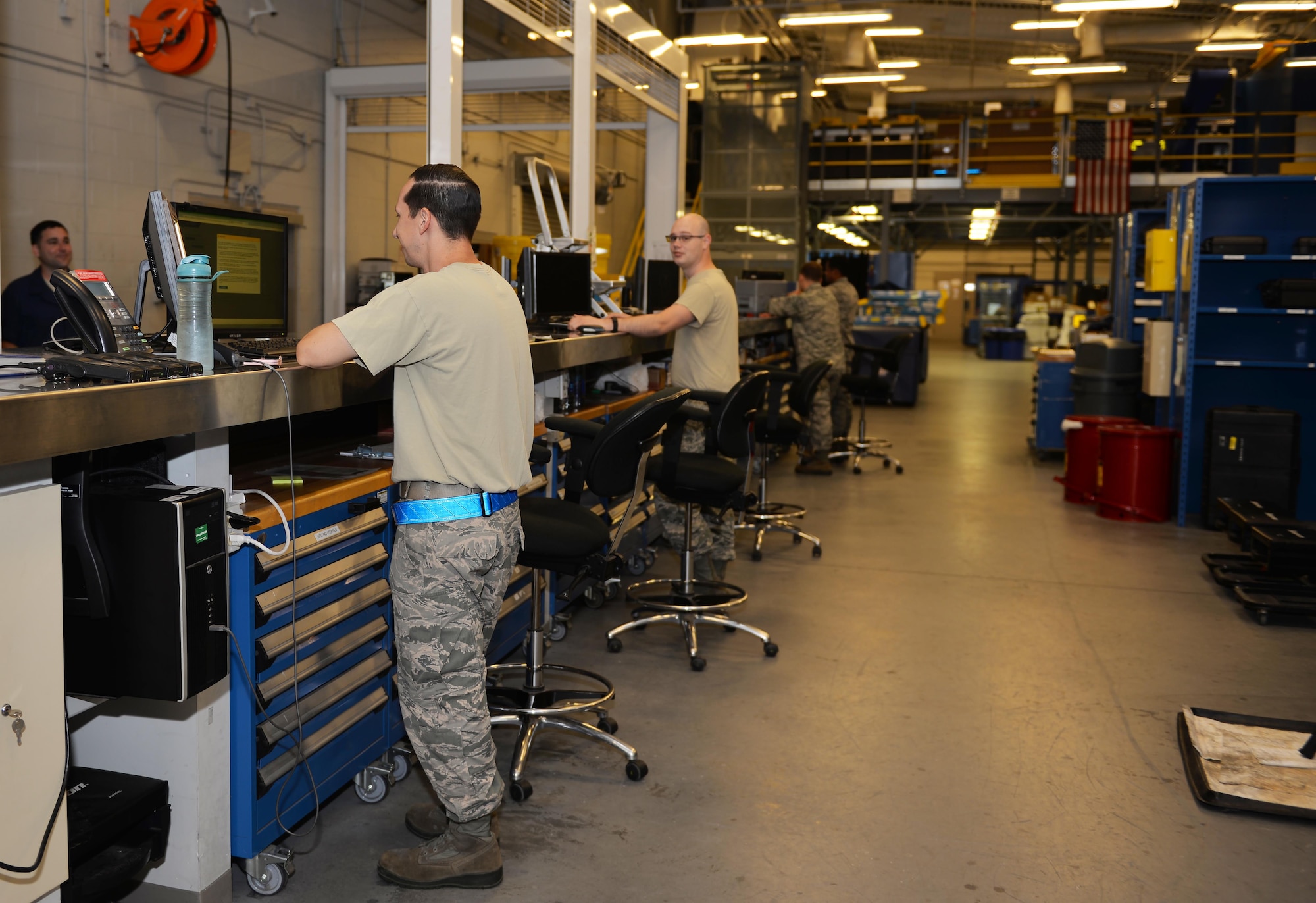 Support Airmen from the 33rd Aircrafts Maintenance Squadron assist crew chiefs with equipment before they go out to the flightline at Eglin Air Force Base, Fla., Oct. 28, 2015. The support desk is where 33rd Fighter Wing Airmen check out equipment for daily maintenance of the F-35A lightning II. (U.S. Air Force Photo/Senior Airman Andrea Posey)
