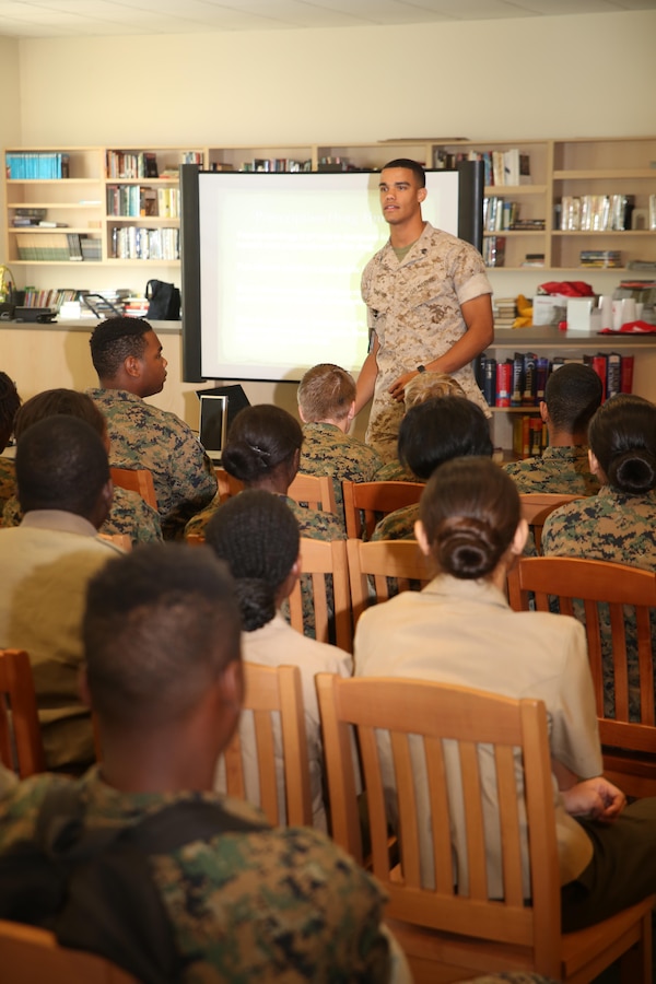 NEW ORLEANS – Sgt. Bryan Sanford, a Marine Corps Community Services Assistant with Marine Forces Reserve, speaks with students at the New Orleans Military and Maritime Academy, Oct. 29, 2015, during Red Ribbon Week. Sanford informed the students that Red Ribbon Week began a few years after the death of DEA agent and former Marine, Enrique Camarena. Agent Camarena was in the process of making a major drug bust of a Mexican drug Cartel in the 1980s. Agent Camarena, along with his pilot, were captured, tortured, and murdered for their attempted actions in 1985. In light of the situation, Agent Camarena's family and friends back home in California started "Camarena's Club" to raise drug awareness. Ultimately, this movement was brought to the attention of President and First Lady Reagan. In 1988, the first National Red Ribbon Week began.  (Marine Corps Photo by Cpl. J. Gage Karwick/Released)