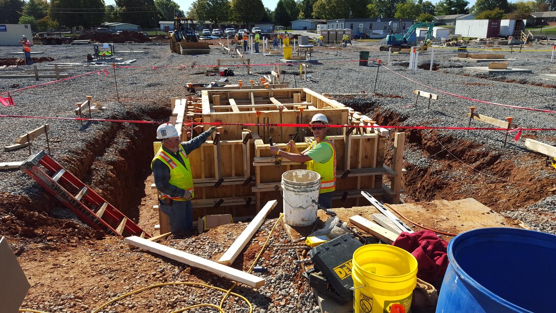 Contractors work on the forms for the vertical walls of the new school.