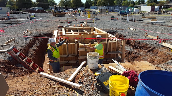 Contractors work on the forms for the vertical walls of the new school.