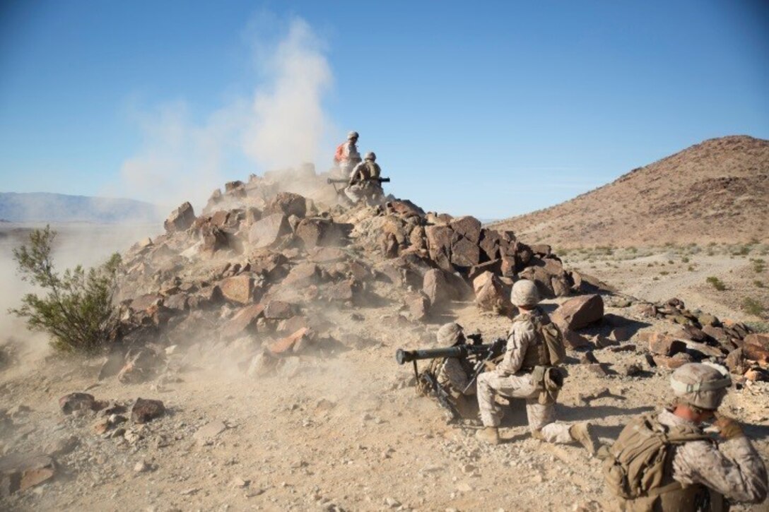 Marines fire rocket launchers during a live-fire and maneuver exercise during an integrated training event on Marine Corps Air Ground Combat Center, Twentynine Palms, Calif., Oct. 24, 2015. During the exercise, Marines conduct infantry mission tasks, and offensive and defensive stability operations.The Marines are assigned to Charlie Company, 1st Battalion, 8th Marine Regiment. U.S. Marine Corps photo by Cpl. Tyler A. Andersen