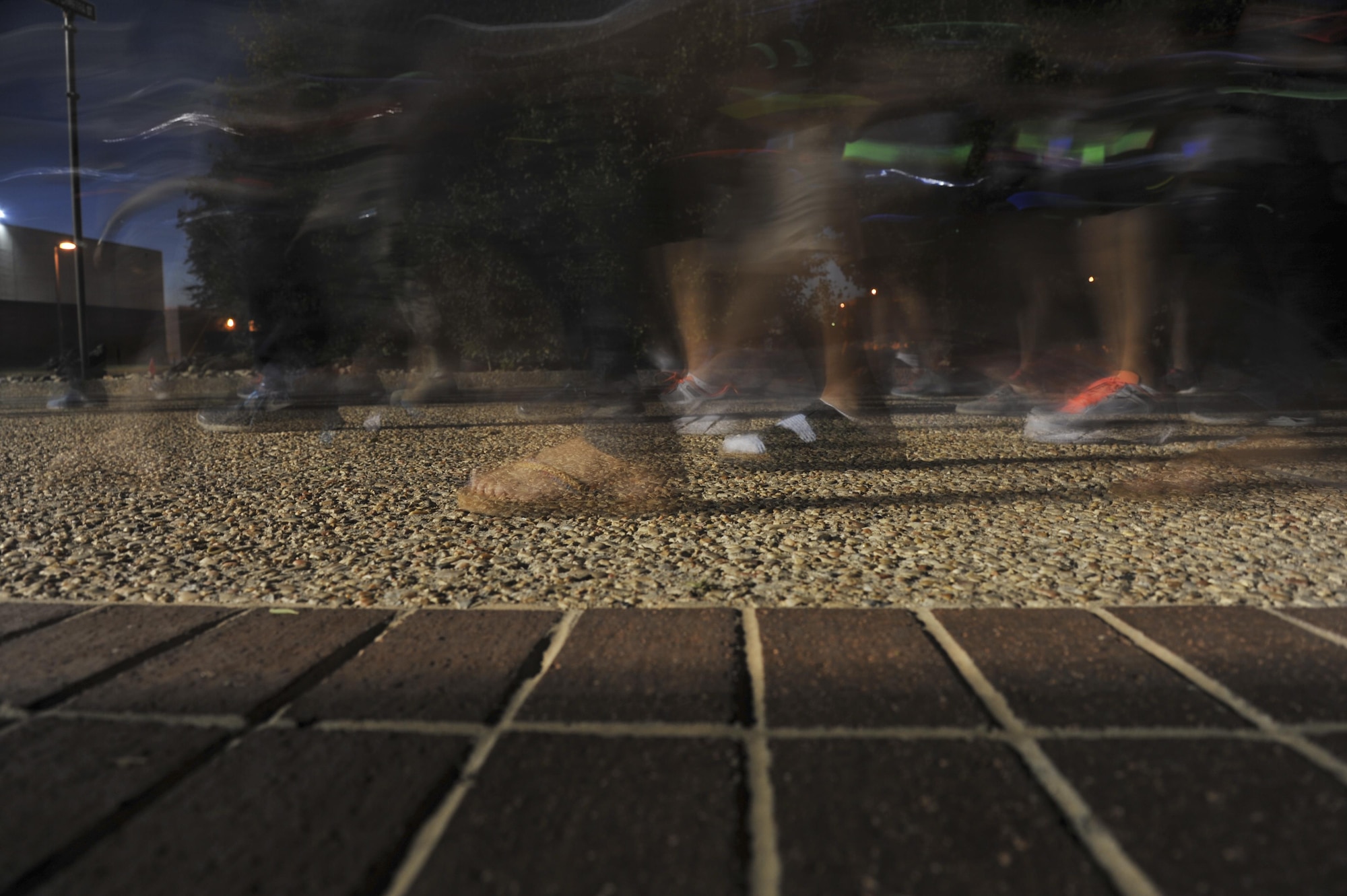 Participants begin their walk at the Sexual Assault Prevention and Response program’s Silent Glow Walk on Goodfellow Air Force Base, Texas, Oct. 27, 2015. The Glow Walk is an event to raise awareness for the SAPR program. (U.S. Air Force photo by Airman Chase Sousa/Released)
