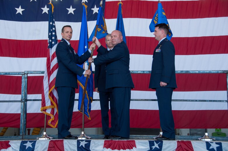 U.S. Air Force Reserve Col. Denis Heinz, commander of the 489th Bomb Group, presents the 489th Maintenance Squadron’s guidon to Maj. Garth Ranz on Oct. 17, 2015 at Dyess Air Force Base, Texas.   Ranz assumes command of the 489th Maintenance Squadron. The 489th Maintnenance Squadron is assigned to the 489th Bomb Group which falls under the 307th Bomb Wing. The 307th Bomb Wing is the only dual bomber mission wing in the Air Force. (U.S. Air Force photo by Master Sgt. Laura Siebert/Released)