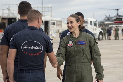 Becky Hammon, San Antonio Spurs assistant coach, shakes hands with a member of the Thunderbirds Oct. 29, 2015, at Joint Base San Antonio-Randolph. The Thunderbirds perform for people all around the world, displaying the pride, precision and professionalism of American Airmen. In every hour-long demonstration, the team combines years of training and experience with an attitude of excellence to showcase what the Air Force is all about.