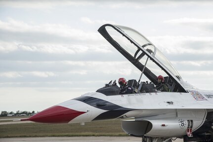 Maj. Scott Petz, Thunderbird #8, and Becky Hammon, San Antonio Spurs assistant coach, prepare to take off Oct. 29, 2015, at Joint Base San Antonio-Randolph. The Thunderbirds perform for people all around the world, displaying the pride, precision and professionalism of American Airmen. In every hour-long demonstration, the team combines years of training and experience with an attitude of excellence to showcase what the Air Force is all about.