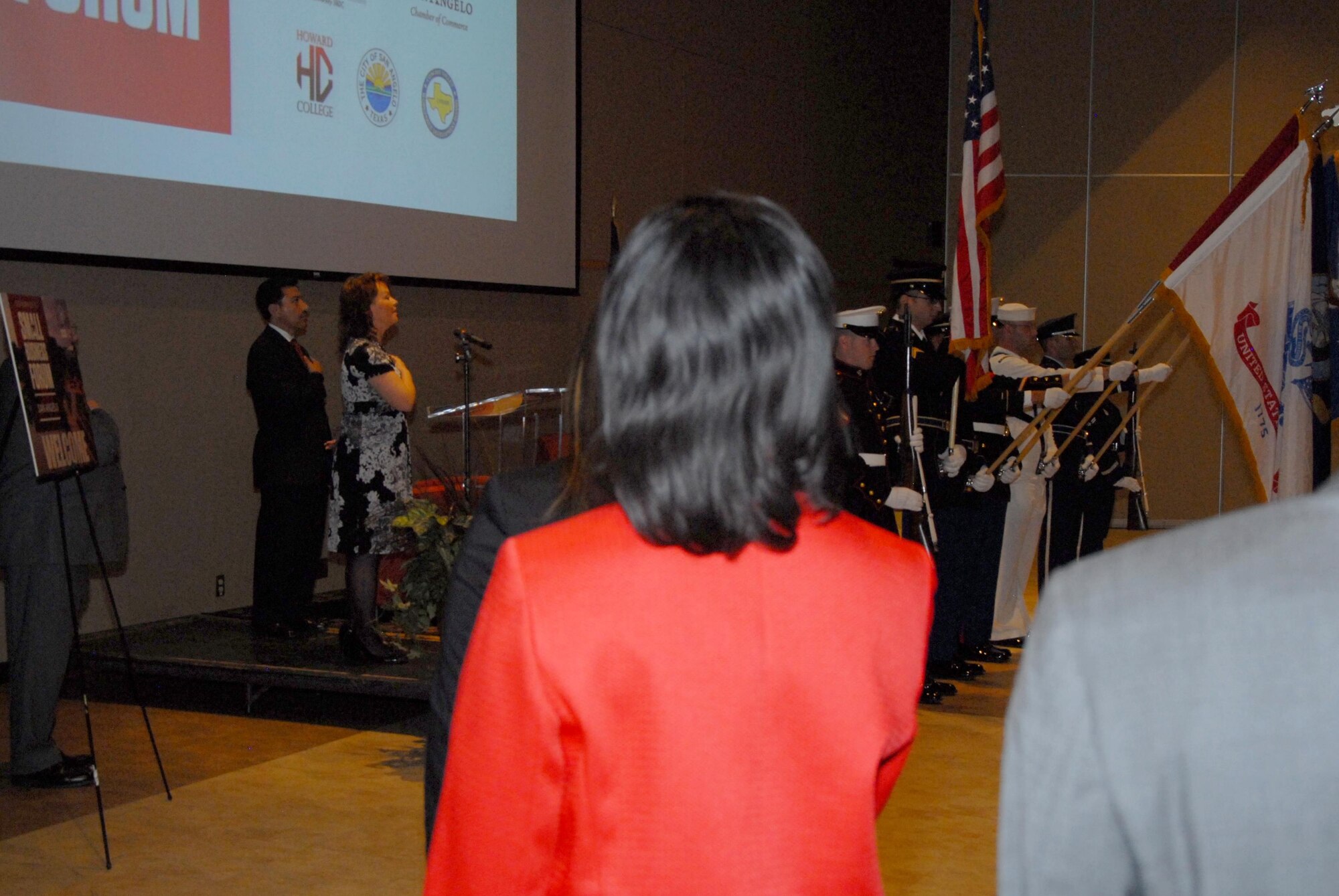 The Goodfellow Air Force Base Joint Service Color Guard present the colors during the national anthem at the 2015 Governor’s Small Business Forum in the McNease Convention Center in San Angelo, Texas, Oct. 28, 2015. The forum recognized small businesses and their contributions to the local committee. (U.S. Air Force photo by Senior Airman Joshua Edwards/Released)