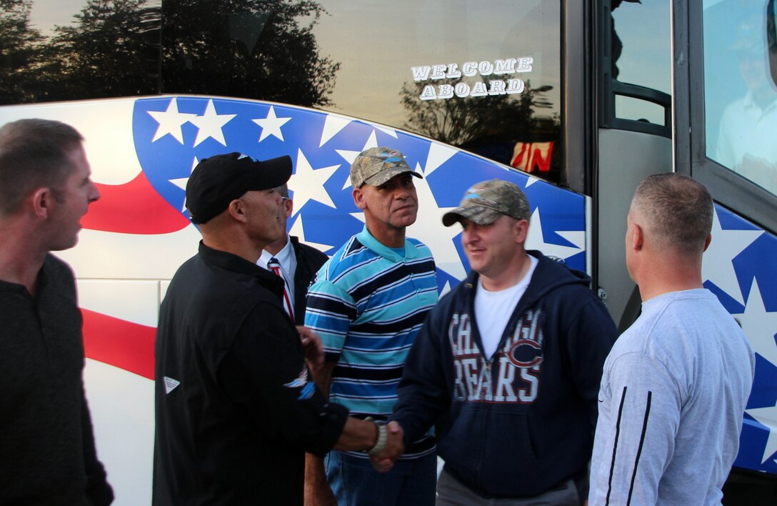 Mike Greenwell, founder of the Warrior Empowerment Foundation, center left, shakes hands with Sgt. Justin Bone, a signal noncommissioned officer with the 412th Civil Affairs Battalion, Oct. 10, 2015. Soldiers with the battalion attended a fundraising event in Prospect, Ky., hosted by the foundation, a nonprofit organization that supports injured soldiers and their families. U.S. Army photo by Master Sgt. David Johnson