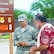 U.S. Air Force Capt. Nhut Dao with the 154th Civil Engineering Squadron, Hawaii Air National Guard, assists Hawaiian 