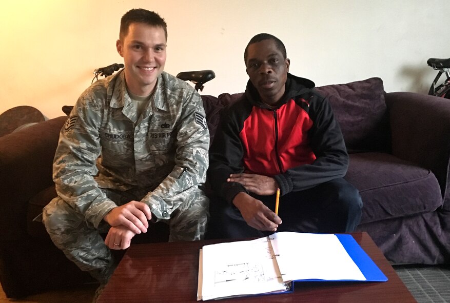 Staff Sgt. Ken Chudoba, 92nd Maintenance Squadron munitions flight accountability technician, mentors Patrick, a refugee from Kenya, Oct. 28, 2015, in Spokane, Wash. Chudoba volunteers two to four hours during his week to assist Patrick in learning English and basic life skills. Patrick has aspirations to become a mechanical engineer. (U.S. Air Force photo/ Staff Sgt. Ken Chudoba)
